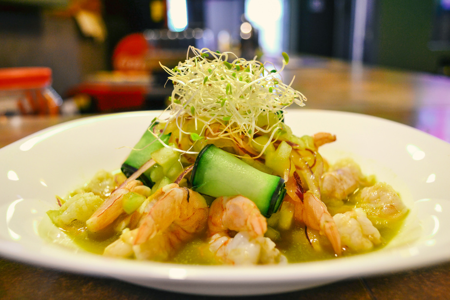 Aguachile of shrimp with green sauce, lemon, and a salad of